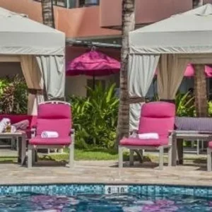 Relaxing poolside cabanas at Malulani in Waikiki resort