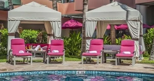 Relaxing poolside cabanas at Malulani in Waikiki resort