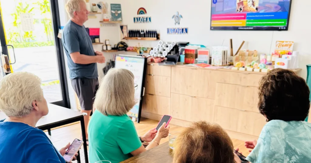 Group tasting fresh honey at a local bee farm