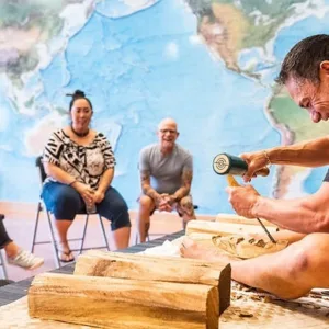 Artist demonstrating traditional Polynesian wood carving skills
