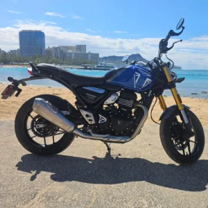 Sleek Triumph Speed 400 motorcycle parked by the ocean
