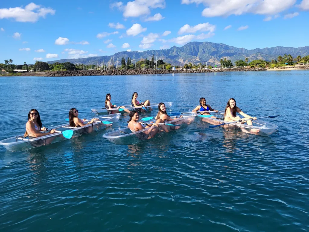 Clear bottom kayak revealing underwater life beneath Oahu