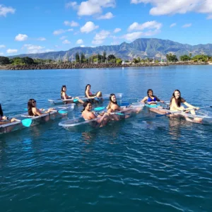 Clear bottom kayak revealing underwater life beneath Oahu