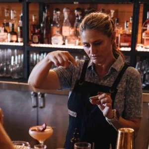 Bartender mixing cocktails during art of mixology class