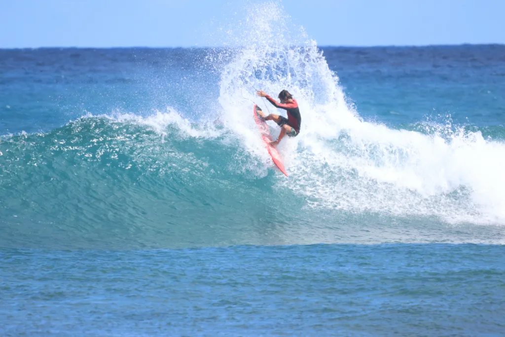 Experienced surfer demonstrating advanced moves on a wave