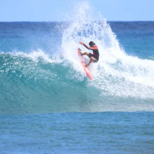Experienced surfer demonstrating advanced moves on a wave