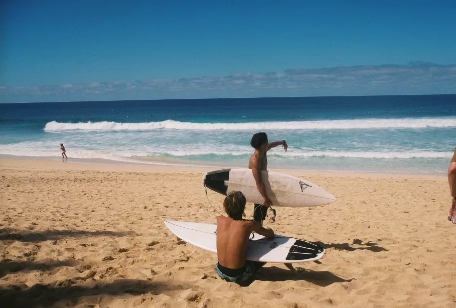 Group enjoying guided surf tour on North Shore waves