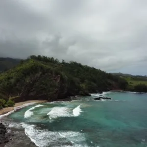 Photographer capturing ocean sunset from a Maui beach