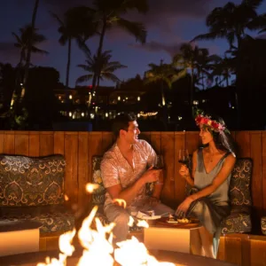 Couple enjoying wine tasting during vibrant sunset