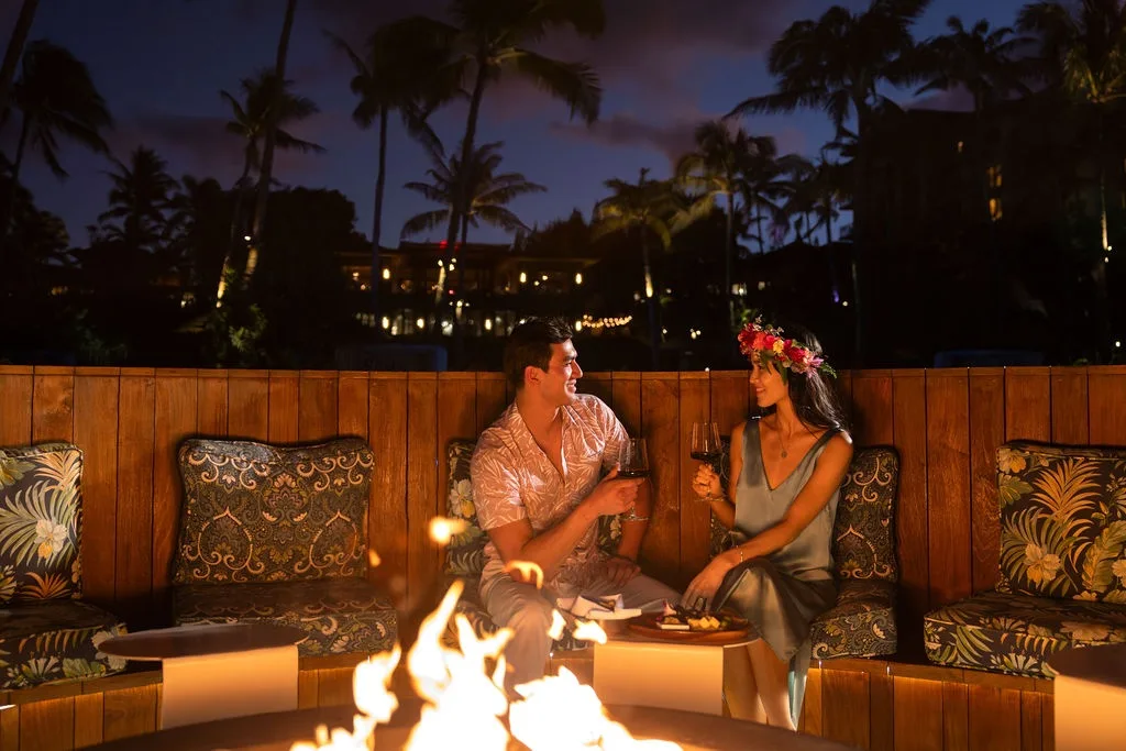 Couple enjoying wine tasting during vibrant sunset