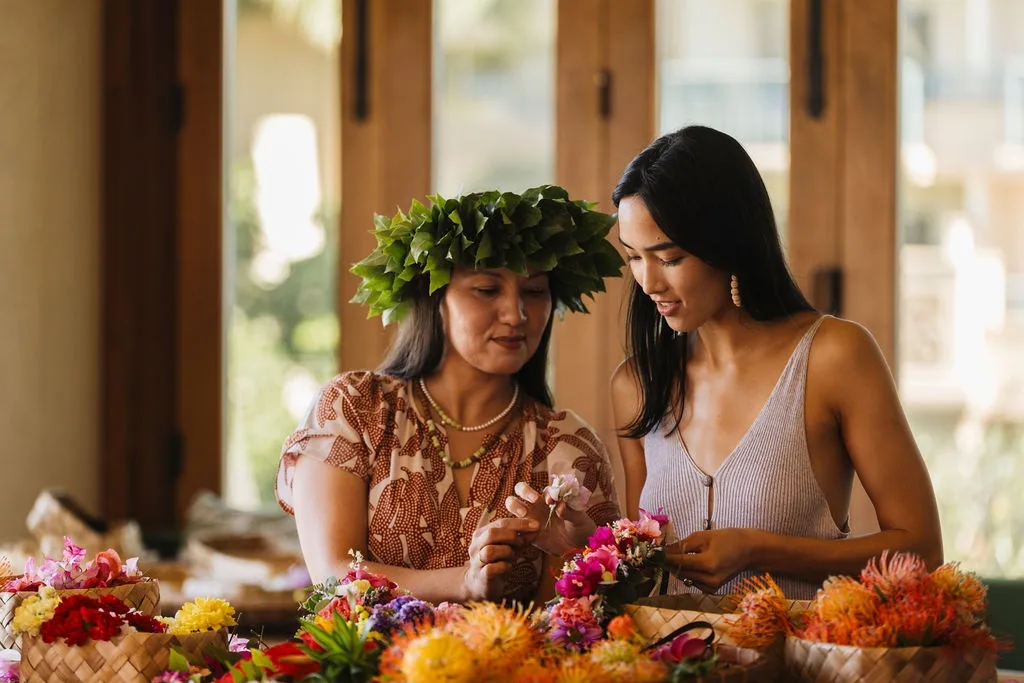 Hands crafting colorful lei po‘o headpiece workshop