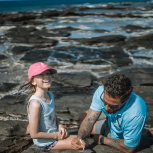 Glowing lava flowing from volcano at night