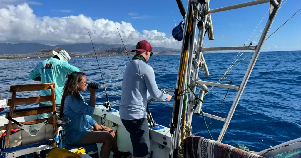 Fishing boat near shore during bottom fishing and trolling trip