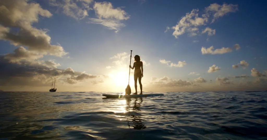 Person learning paddling basics on calm water