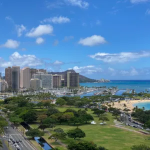 Circle Island Tour boat cruising along ocean coastline