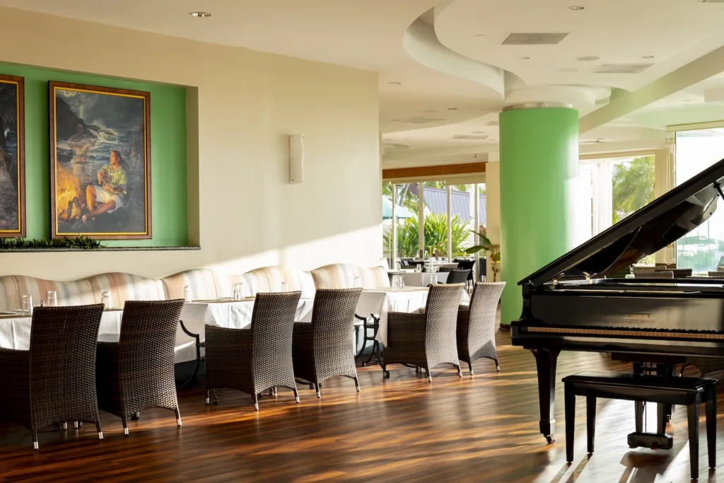 Performers dancing traditional Hawaiian hula at Menehune Grille