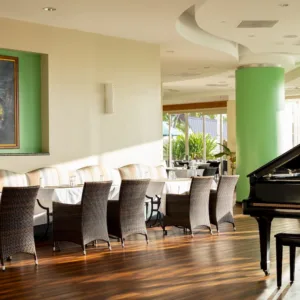Performers dancing traditional Hawaiian hula at Menehune Grille