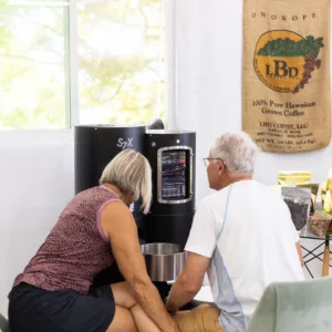Visitors enjoying coffee roasting on Kona island tour