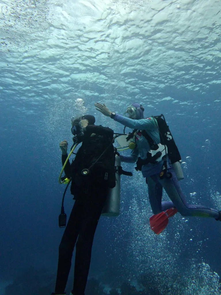 Navigator plotting a course on a scuba diving boat