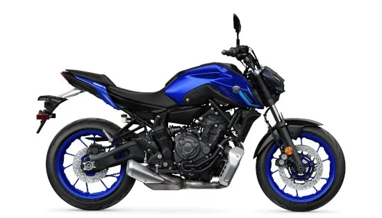Yamaha MT-03 motorcycle parked along scenic highway