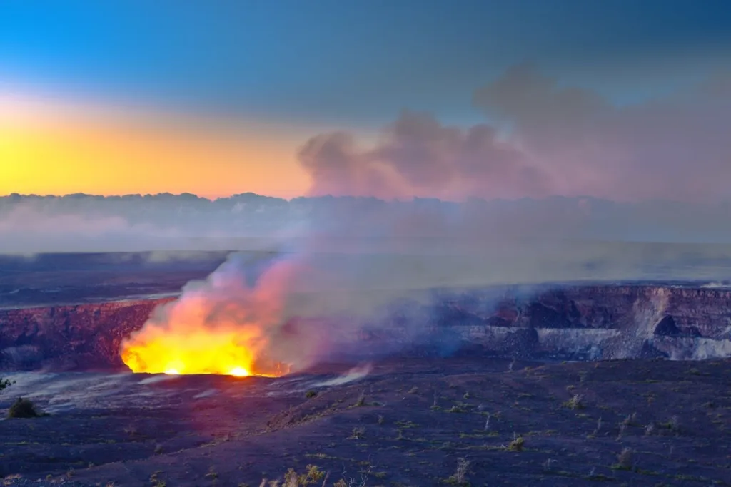 Hikers admiring waterfall on Big Island volcano trail
