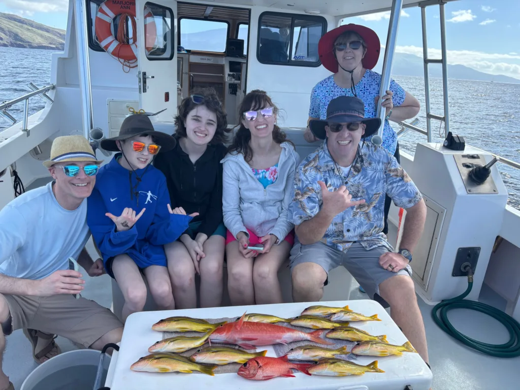 Shared fishing charter boat with anglers casting lines