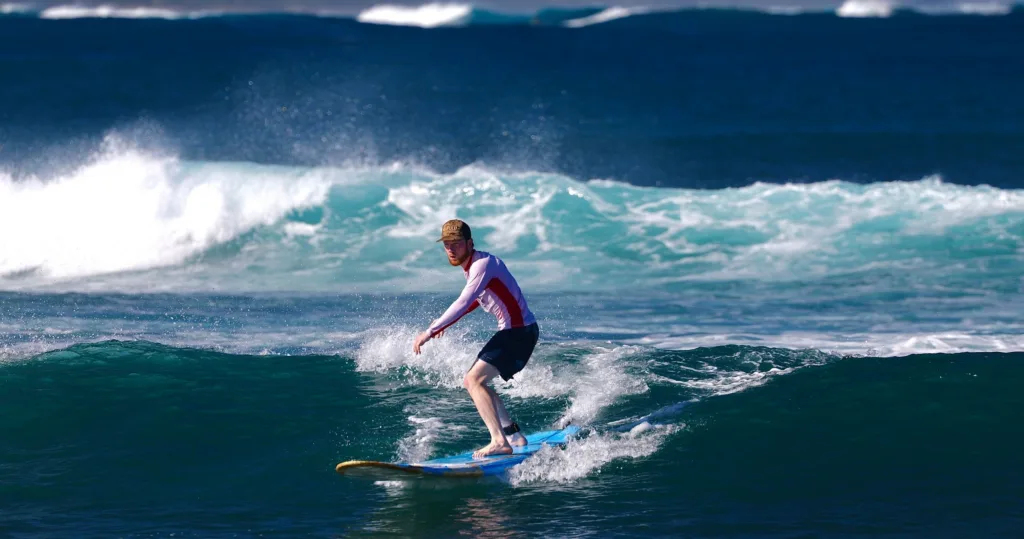 Instructor giving private beginner lesson on island beach