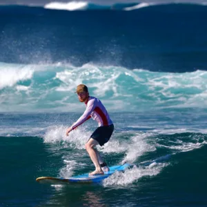 Instructor giving private beginner lesson on island beach