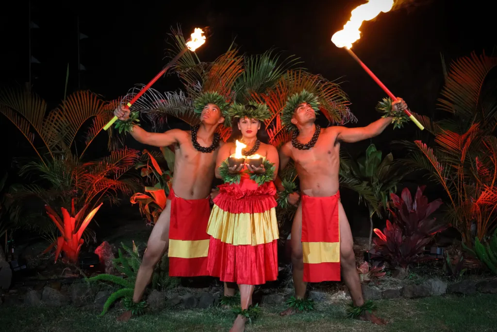 Guests experiencing traditional Hawaiian luau with gold package