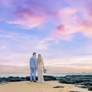 Couple smiling for professional photoshoot in Oahu park