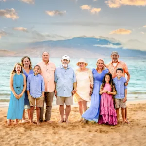 Family posing for professional photos on Kauai beach