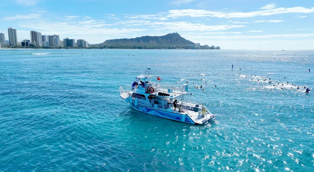 Island Breeze private boat cruising Waikiki’s turquoise waters