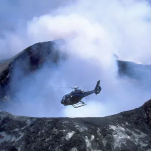 Helicopter flying over volcanic landscape near Kona