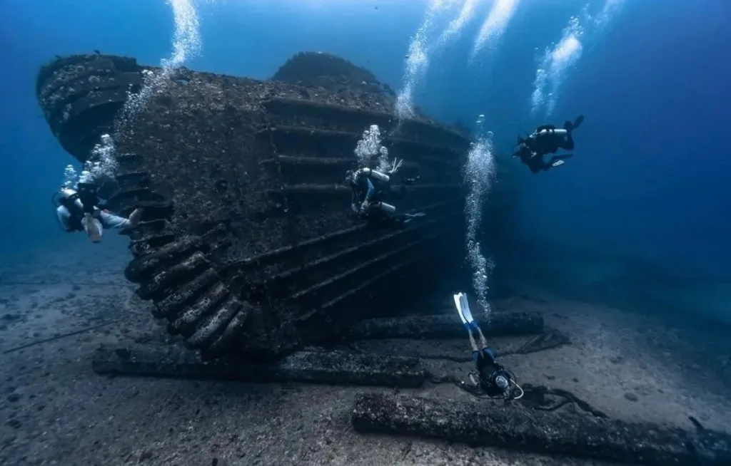 Scuba diver investigating the Seatiger shipwreck underwater
