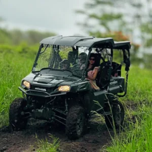 Group riding UTV vehicles through rugged terrain