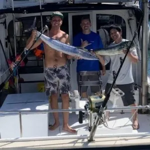 Half-day shared sport fishing trip with anglers on boat deck