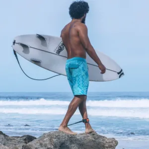 Family enjoying surfing lessons during Imua Ohana sunset experience