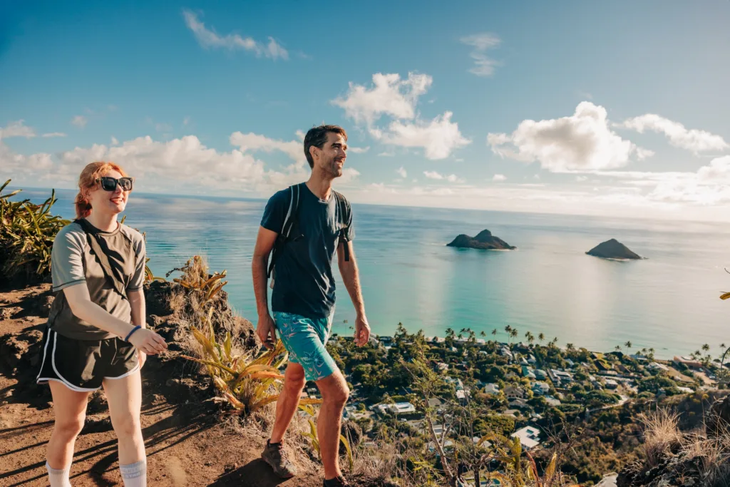 Cyclist riding e-bike along Lanikai beach trail