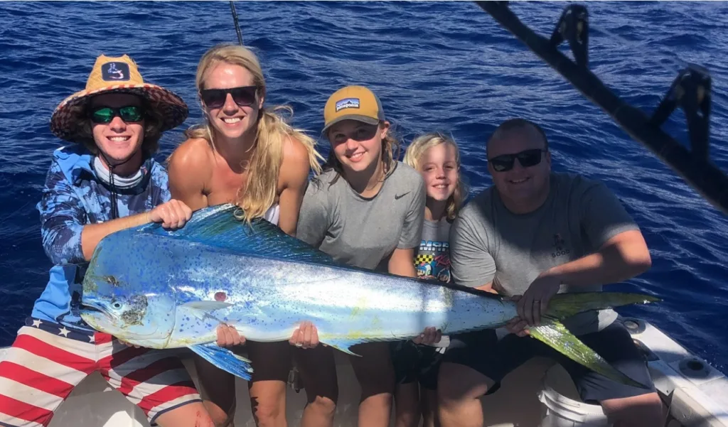 Charter boat anchored near Kona coast at sunset