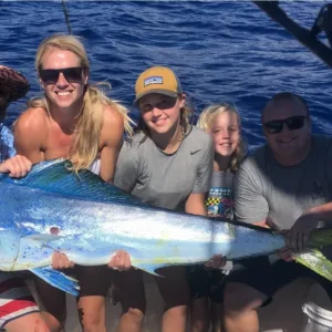 Charter boat anchored near Kona coast at sunset