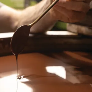 Visitors enjoying a guided chocolate factory tour