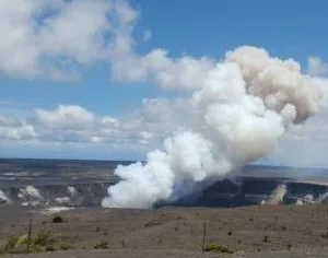 Volcano crater with steam rising during adventure tour