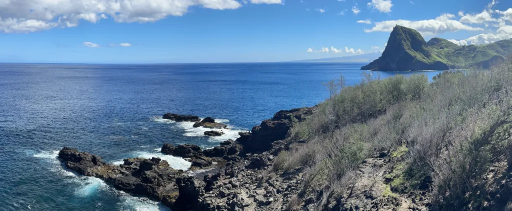 Panoramic view of West Maui mountains and ocean coastline