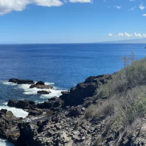 Panoramic view of West Maui mountains and ocean coastline