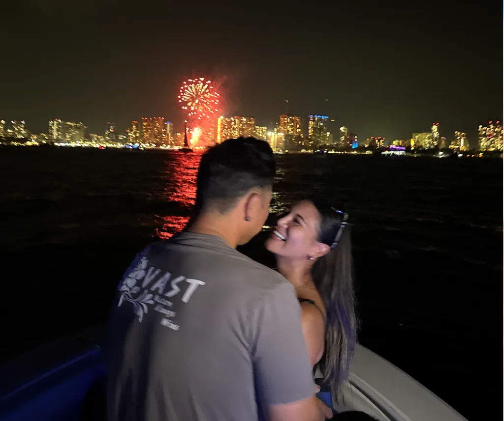 Couples enjoying a private sunset with fireworks display