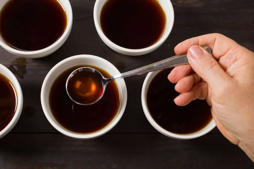 Participants smelling freshly brewed coffee during cupping workshop