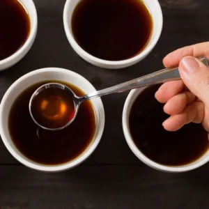 Participants smelling freshly brewed coffee during cupping workshop