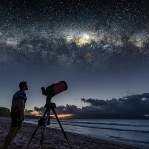 Couple stargazing under clear night sky on private tour