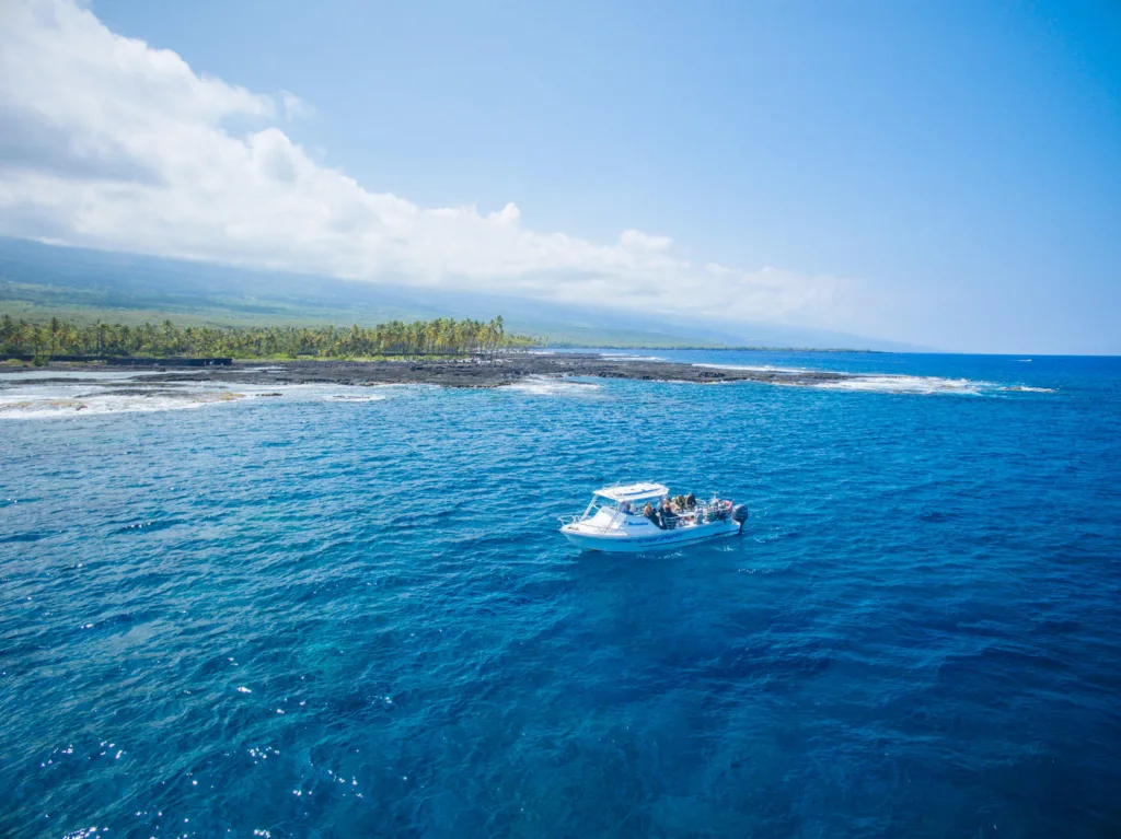 Scuba divers preparing for long range two tank morning dive