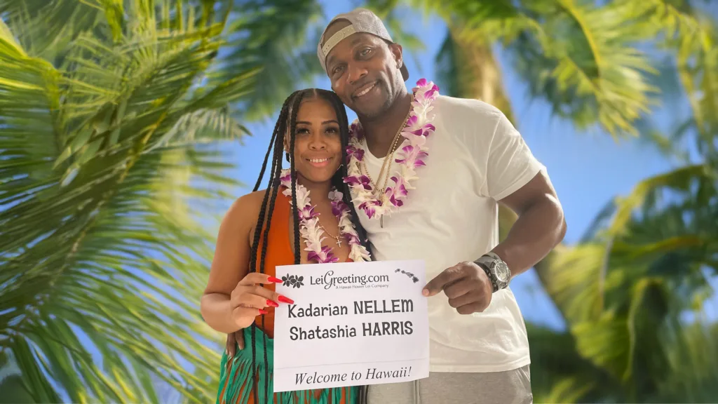 Honeymoon couple receiving lei greeting at Honolulu Airport